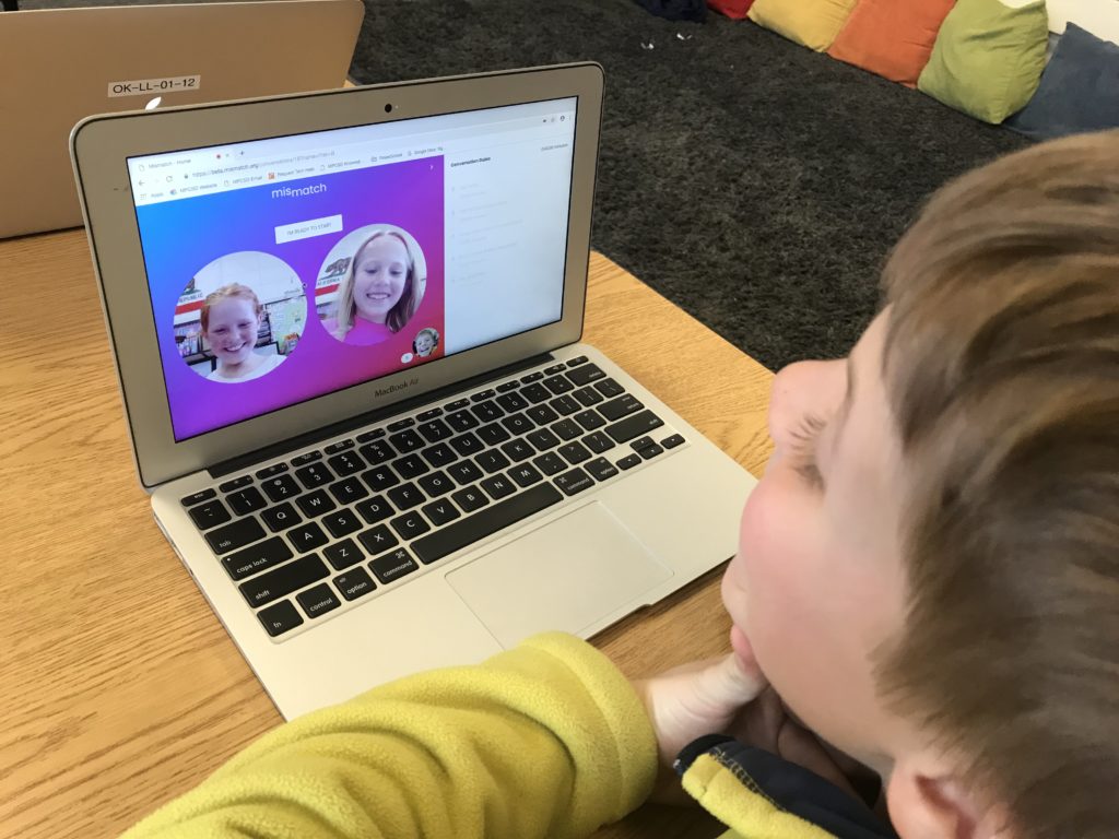 Students Looks at the Mismatch Platform on a computer
